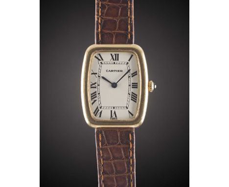 A GENTLEMAN'S SIZE 18K SOLID GOLD CARTIER FABERGE TONNEAU WRIST WATCHCIRCA 1980sMovement: 17J, manual wind, signed Cartier.Ca