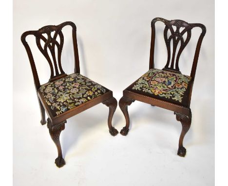 A pair of 19th century Chippendale-style dining chairs with tapestry covered seats (2).