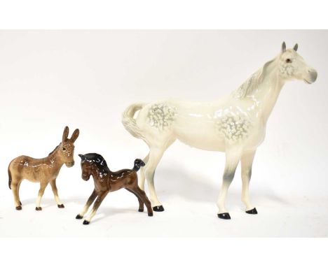 BESWICK; three figures comprising a dappled grey horse, a foal and a small ass, height of largest 21cm (3).Condition Report: 