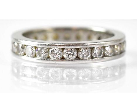 A platinum and diamond eternity ring set with diamonds, size M, approx. 5.7g.