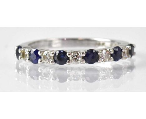 A 14k white gold ring set with sapphires and diamonds, size O, approx. 2.5g, with original receipt from Effy.