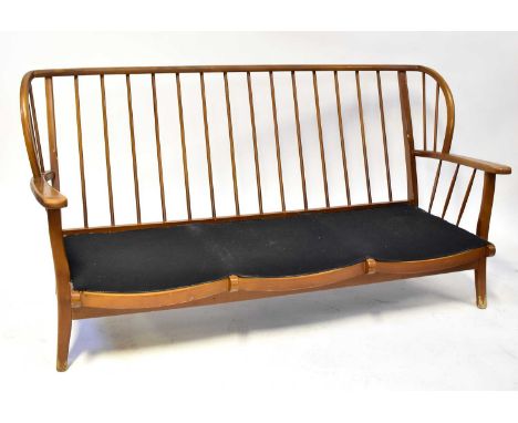 ERCOL; an elm stick back three-seater settee on square tapering legs, 81 x 166cm.