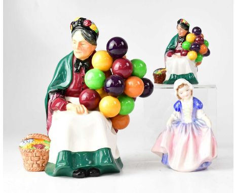 ROYAL DOULTON; three figures, HN1315 'The Old Balloon Seller', a miniature version HN2129, and a Royal Doulton HN1678 'Dinky 