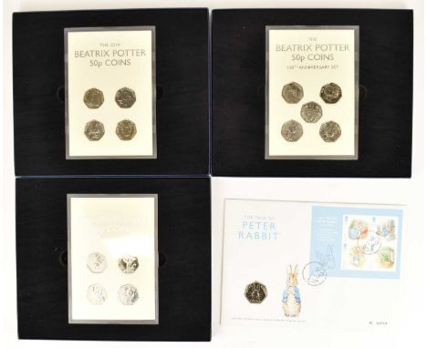 WESTMINSTER MINT; three Beatrix Potter 50p coin sets, each comprising a Perspex slab containing four UK brilliant uncirculate