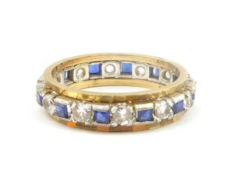 A 9ct gold eternity ring, the central band set with sapphires and white stones in white gold mounts, size U, approx. 4.9g.Con