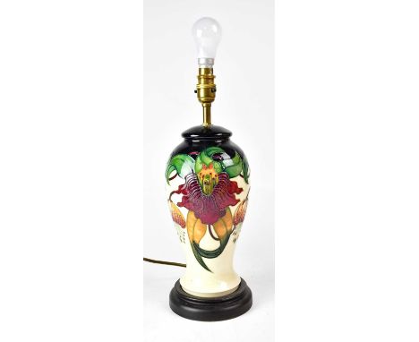 MOORCROFT; an 'Anna Lily' pattern table lamp raised on circular base, height including fitment 39cm.Condition Report: - This 