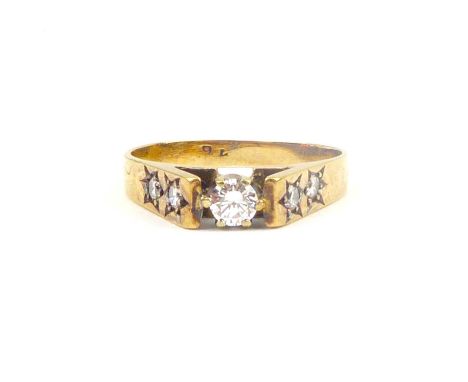 A 9ct gold ring with cathedral set small brilliant cut diamond, approx. 0.18ct, flanked by two star inset small brilliant cut