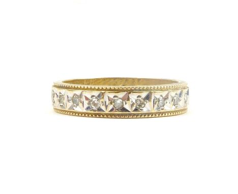 A 9ct gold eternity ring set with tiny diamonds, approx. 0.2ct, size L, approx. 3.2g.