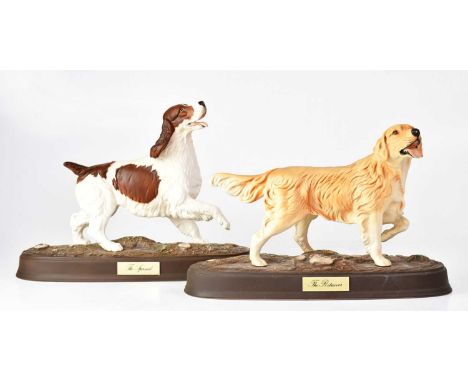 BESWICK; two matt glazed figures of dogs raised on naturalistic plinths, with applied brass-effect plaques, titled 'The Spani