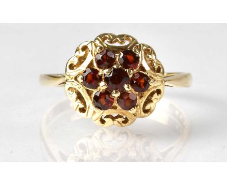 A 9ct yellow gold garnet cluster ring, size U, approx. 3.2g