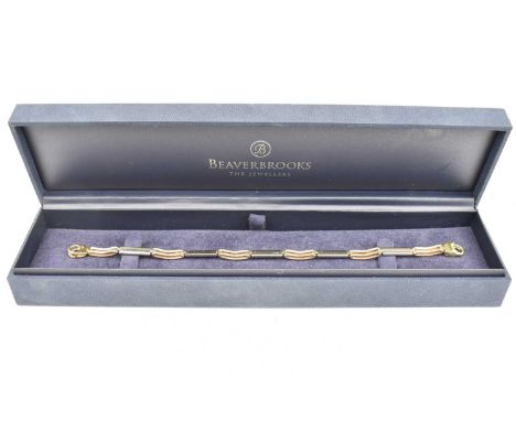 A 9ct gold bracelet, open and solid links with lobster claw ring clasp, length 18cm, approx. 7.3g.Condition Report: In Beaver