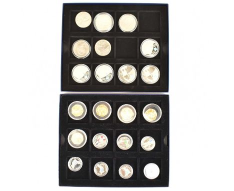 A quantity of commemorative coins comprising two 'Winston Churchill, Be Daring, Be First, Be Different, Be Just', and three '