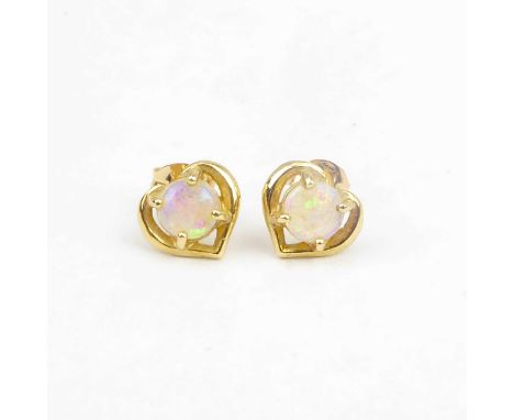 A pair of 9ct gold heart-shaped earrings, with claw set opal-style stone to the centre.