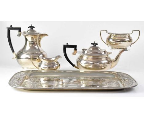 WILLIAM ADAMS LTD; a George V hallmarked silver four piece tea service of oval baluster form, comprising teapot, and hot wate