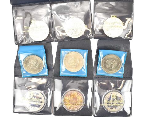 Nine various loose and encapsulate £5 and crown coins, some with lithograph printed design, including RAF (9).
