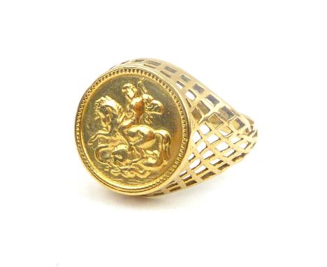 A 9ct gold signet ring with central coin-style George and Dragon circular panel, open basket shoulders, size O, approx. 2.8g.