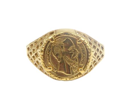 A 9ct gold signet ring set with small Mexican coin to open basket shoulders, size N, approx. 2.8g.