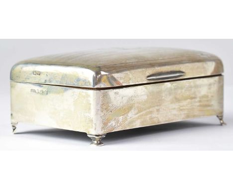 JAMES WALTER TIPTAFT; a George V hallmarked silver cigarette box, the lid with engine turned decoration and monogram 'FGN' in