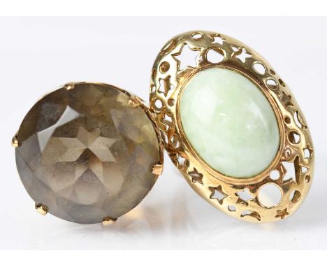 A 9ct yellow gold ring set with green hardstone, in a pierced oval mount, size Q, together with a 9ct yellow gold ring set wi