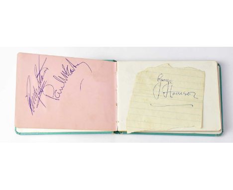 THE BEATLES; an autograph book bearing signatures of Ringo Starr and Paul McCartney to the first page, with a loose piece of 