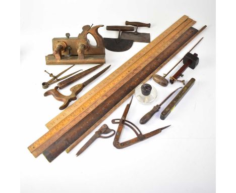 Various mixed vintage tools to include rulers, wood planes, hand tools, scribes, saws, compass, etc.