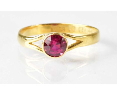 A 22ct yellow gold ring set with a ruby, size approx. N, approx. 1.8g.  Condition Report: Shank is very misshapen.stone is 4m