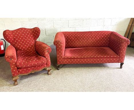 A small vintage Chesterfield style two seat settee; together with a small wing armchair, both upholstered in red and gold fab