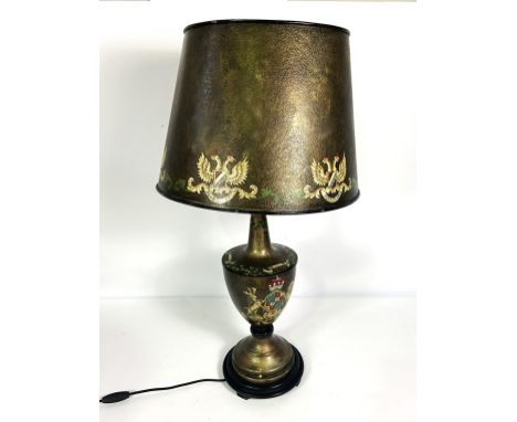 A modern &lsquo;toleware&rsquo; style table lamp, with decorative armorial on the urn shaped base, with conforming shade, the