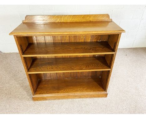 A vintage oak open bookcase, with two adjustable shelves, 107cm high, 108cm wide, 36cm deep