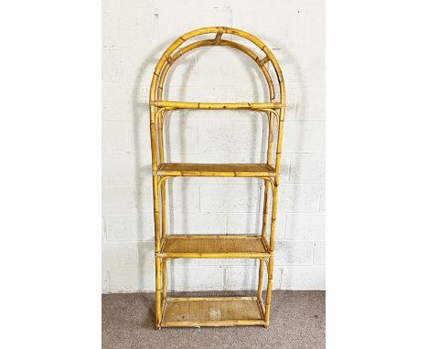 A tall four shelf bamboo stand, 20th century, with arched top and woven bamboo shelves, 185cm high