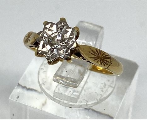 A diamond and 18 carat gold ring, with 1/16th carat diamond set in star setting with 18 carat hallmarked yellow gold, ring si