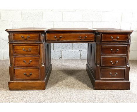 A good vintage George III style pedestal desk, 20th century, with triple leathered top, over arrangement of nine drawers, wit