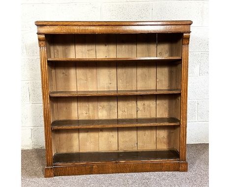 A vintage oak open bookcase, with three adjustable shelves, 112cm high, 104cm wide