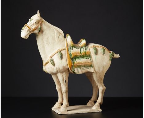 Chinese Art A Tang style earthenware horse figureChina, 19th century or earlier . . Cm 44,50 x 43,50 x 15,00.