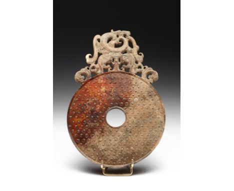 Chinese Art A jade Pi disc China, Qing dynasty, 19th century (?). . Cm 14,00 x 21,00. A large calcified jade carving with the