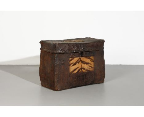 Himalayan Art A leather chest decorated with tiger skin inserts Tibet, 19th century . . Cm 64,00 x 47,50 x 30,50.