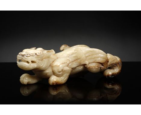 Chinese Art A marbled jade Bixie carving China, Qing dynasty, 19th century . . Cm 23,50 x 8,50. A marbled jade carving depict