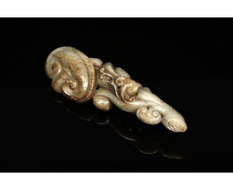 Chinese Art A lingzhi jade carving China, Qing dynasty, 19th century . . Cm 6,50 x 19,00. A gray/green marbled brown jade car