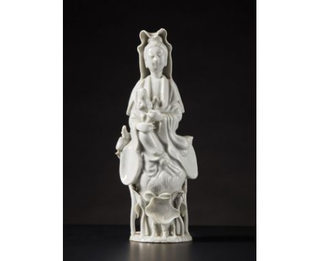 Chinese Art A Dehua porcelain figure of Guanyin and child China, 19th century . . Cm 9,00 x 22,00.