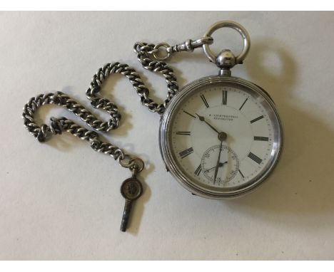 SILVER POCKET WATCH - on a silver chain with key. Dial marked S.Lichtenstein Manchester with Roman numeral markers and subsid