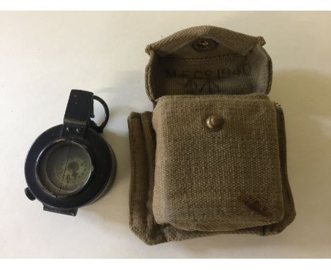 WORLD WAR II COMPASS - made by T.G. Co Ltd London. No.82563, dated 1940, Mark III. In original case also date 1940.