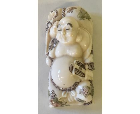 IVORY NETSUKE - quality signed Meiji period Japanese carved netsuke of a man sleeping with colour engraved robes. 5cm in leng