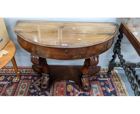 A Victorian mahogany demi lune side table having a hinged top and shelf below, 67h x 104wLocation: 