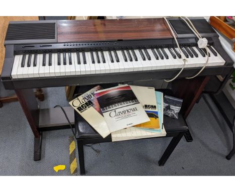 A Yamaha Clavinova CVP-5 electric keyboard piano, together with stool and instruction manual and related books Location: 