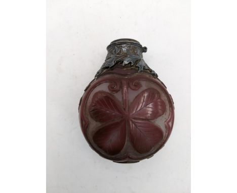 A 19th century cameo glass scent bottle with white metal collar, decorated with a four leaf clover in relief, overlaid in eng