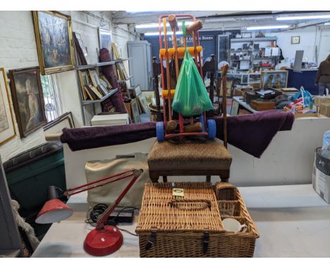 A mixed lot to include a Singer 7/46 sewing machine and cover, a modern Anglepoise lamp, a bolt of purple fabric, a walking c