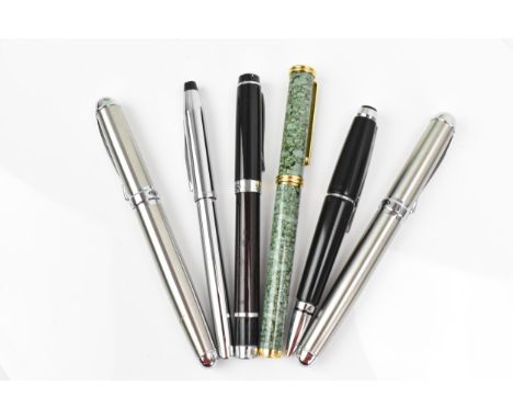 A collection of pens, comprising a L'Plume piston fill fountain pen, in green mottled enamel finish with gilt trim and plated