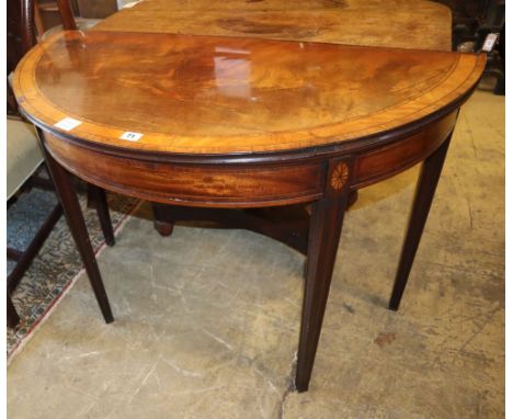 A George III satinwood banded mahogany demi lune folding card table, W.99cm, D.49cm, H.73cm