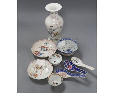 Two 18th century Chinese famille rose tea bowls and two saucers, together with three rice spoons and a bowl