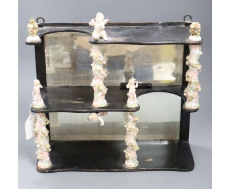 A decorative ceramic and wooden and mirrored wall shelf, height 35cm width 35cm